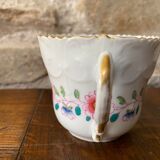 Porcelain cup with chiseled and gilded rim