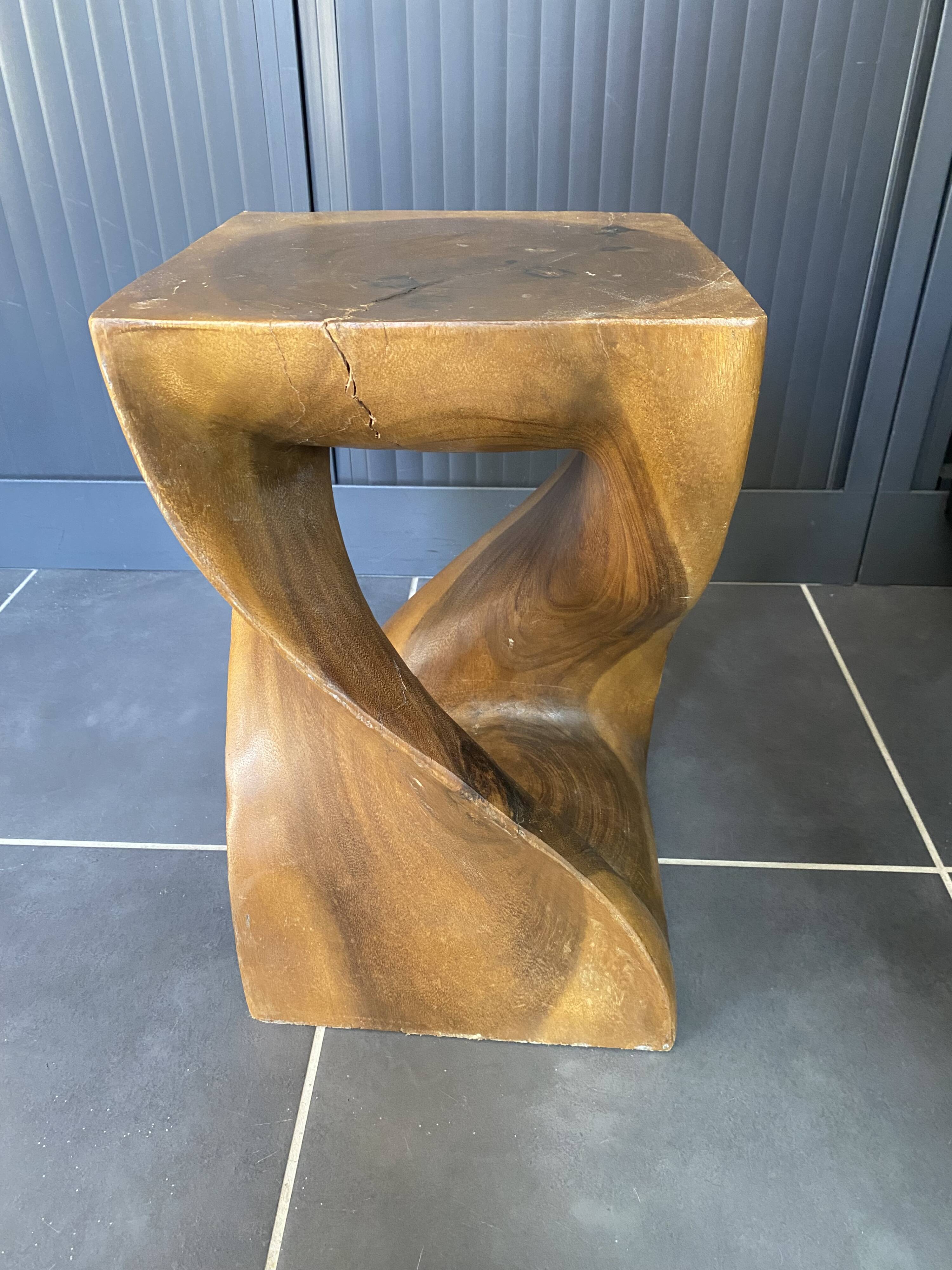 Stool n2 in solid raw walnut wood carved from the mass 1970