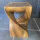 Stool n2 in solid raw walnut wood carved from the mass 1970