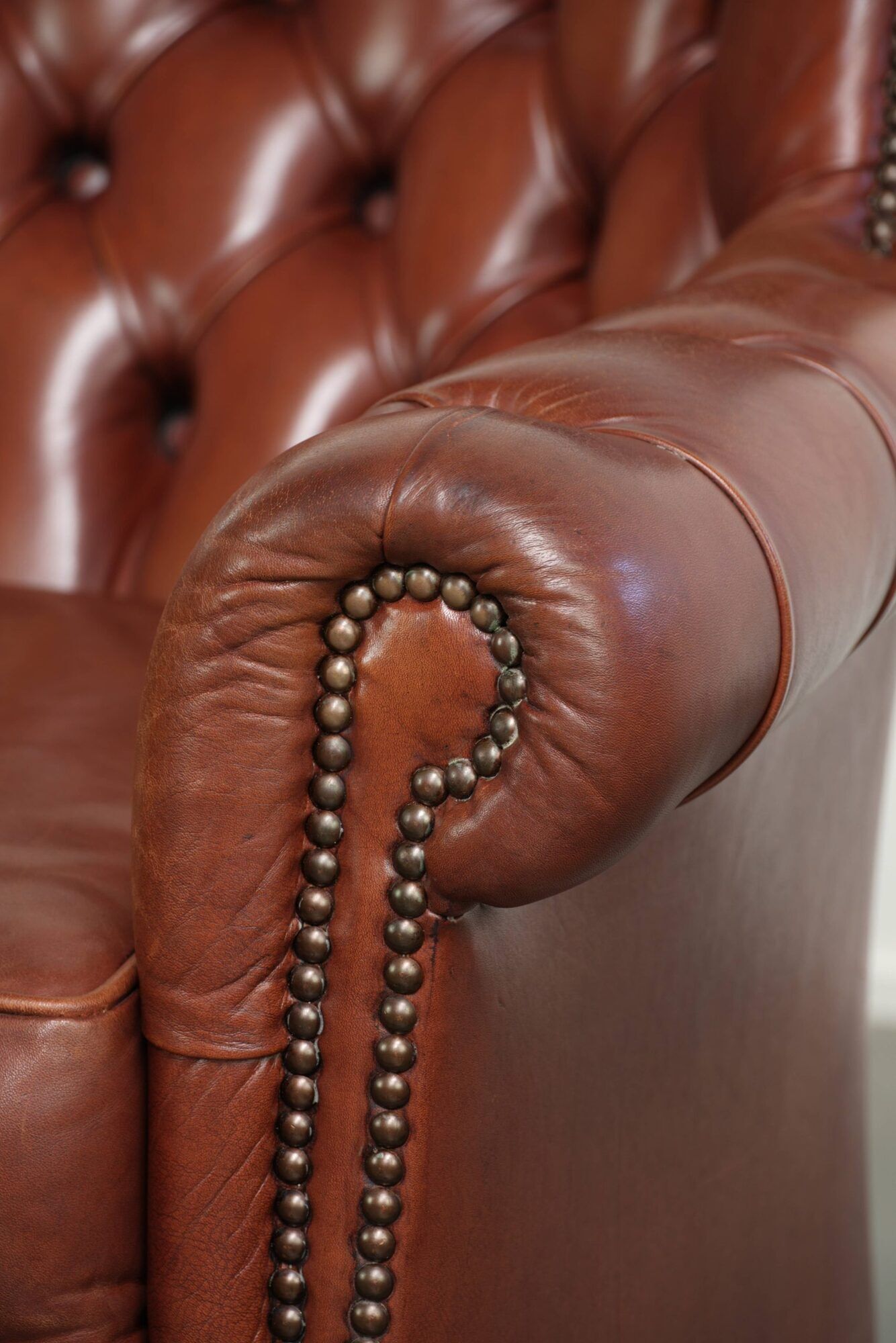 Cognac-coloured cow leather Chesterfield armchair in English style