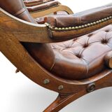 Pair of leather Chesterfields and footstools