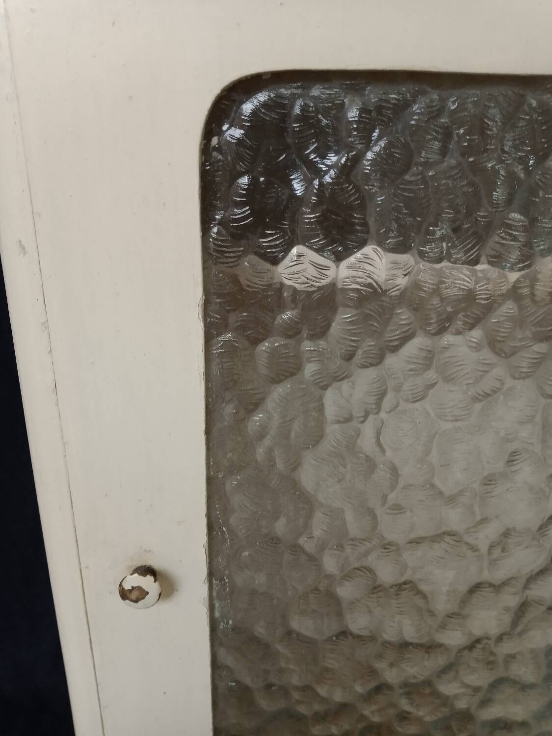 Old wall cabinet with one door and one drawer