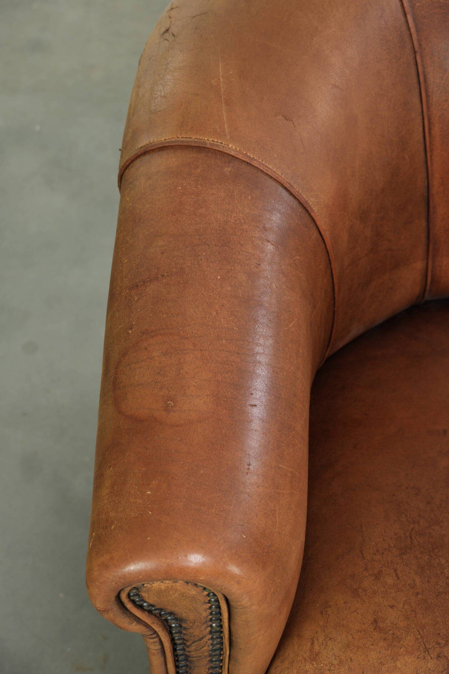 Sturdy set of vintage sheepskin club armchairs with a great appearance