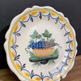 Faience dish of eighteenth-century style nevers decorated with basket with bunches of grapes