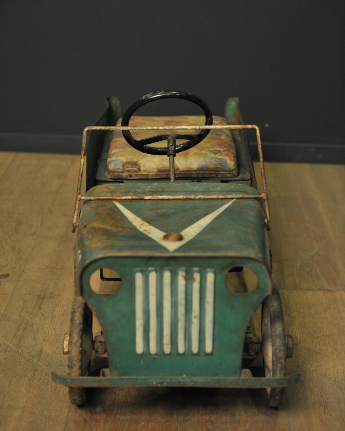 Green metal pedal car