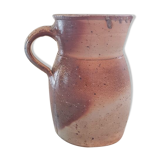 Pitcher in varnished sandstone