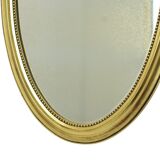 Miroir ovale classique doré à décor de ruban, France