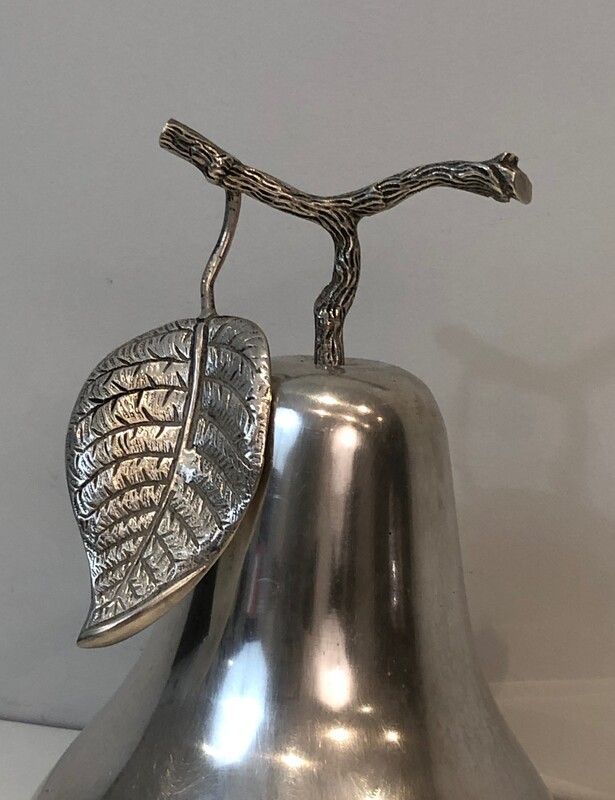 Silver-plated metal and plastic pear-shaped ice bucket.