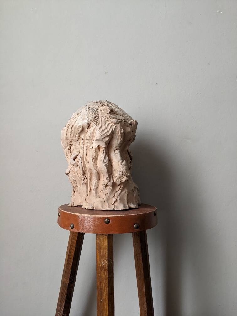 Handmade clay terracotta sculpture head decoration workshop