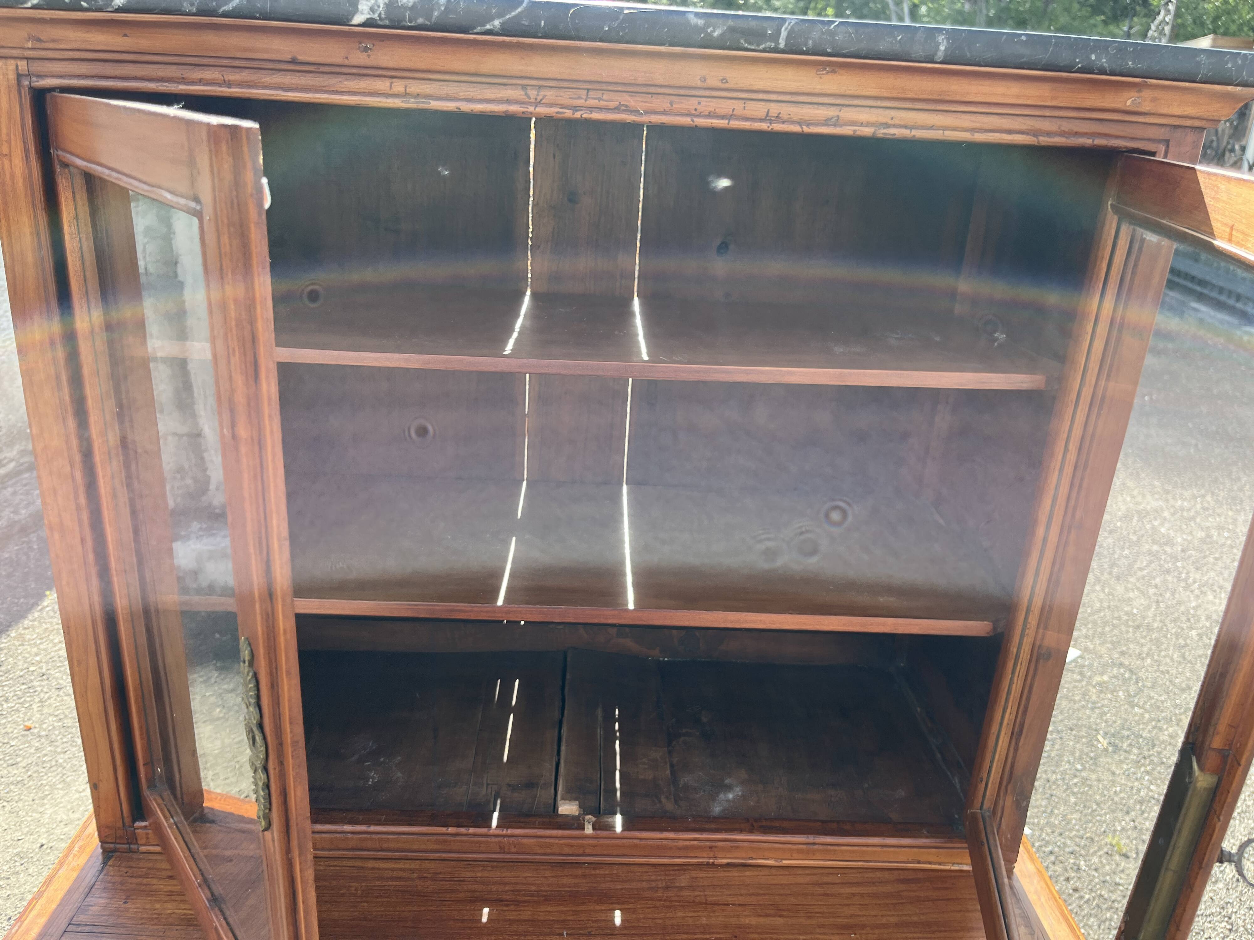 Victorian English two-body buffet with cherry wood on marble display case from the 19th century.