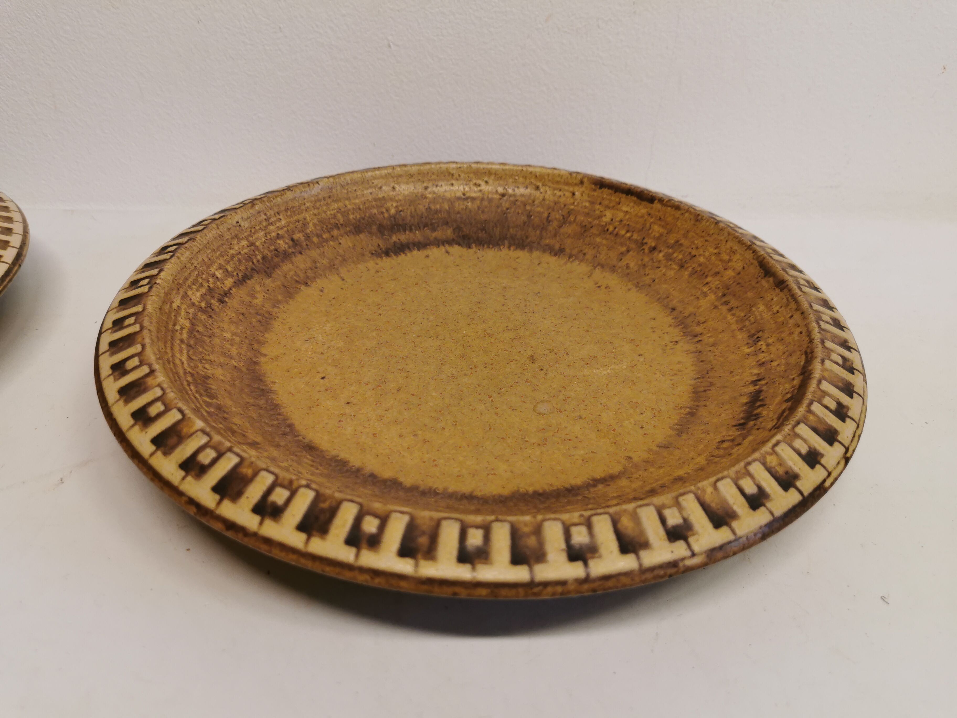 Ceramic plates, designed and made by Danish Ravnild (both stamped and signed)