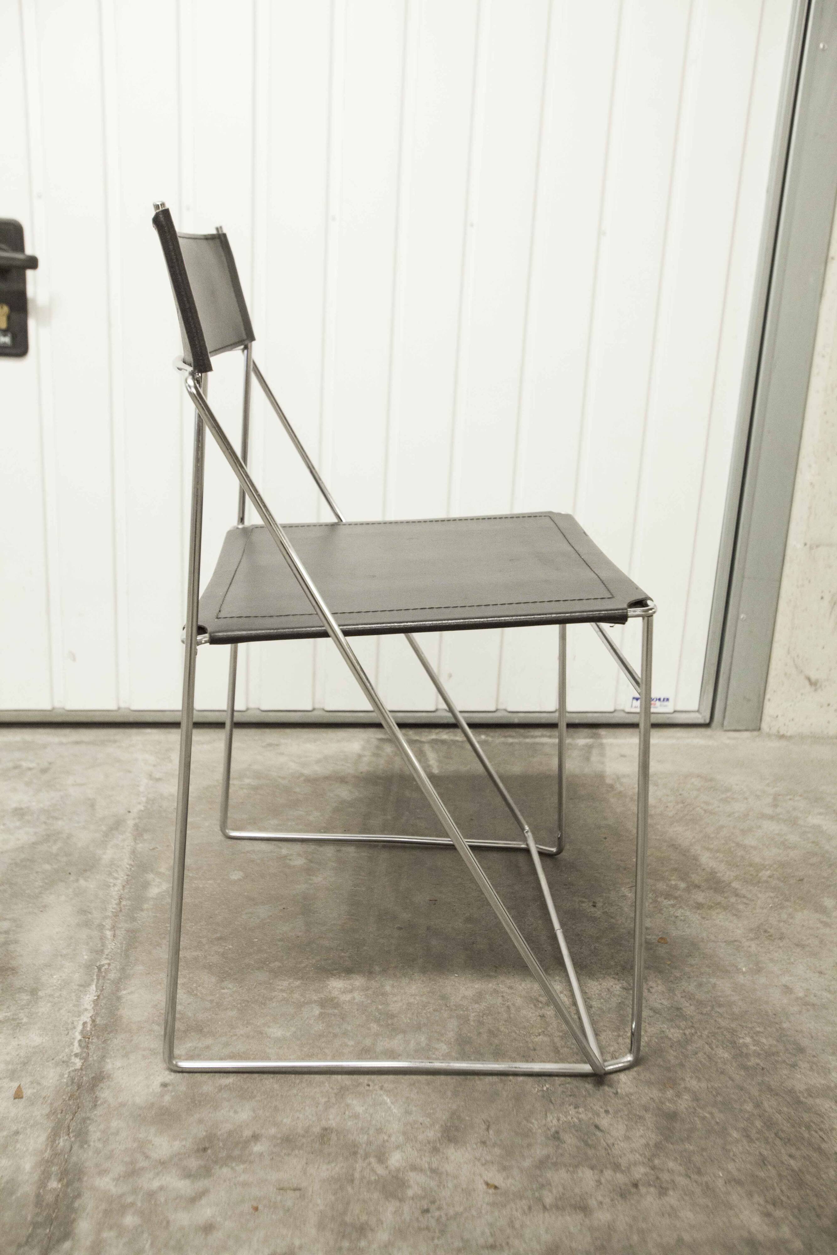 Set of 3 minimalist X line chairs by Niels Jorgen Haugesen.