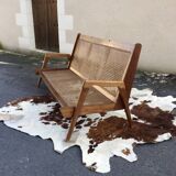 caned teak bench
