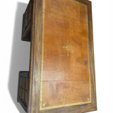 Oak desk with 9 drawers and leather writing pad.
