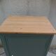 Vintage jam jar enhanced in smoky green, wooden tray.