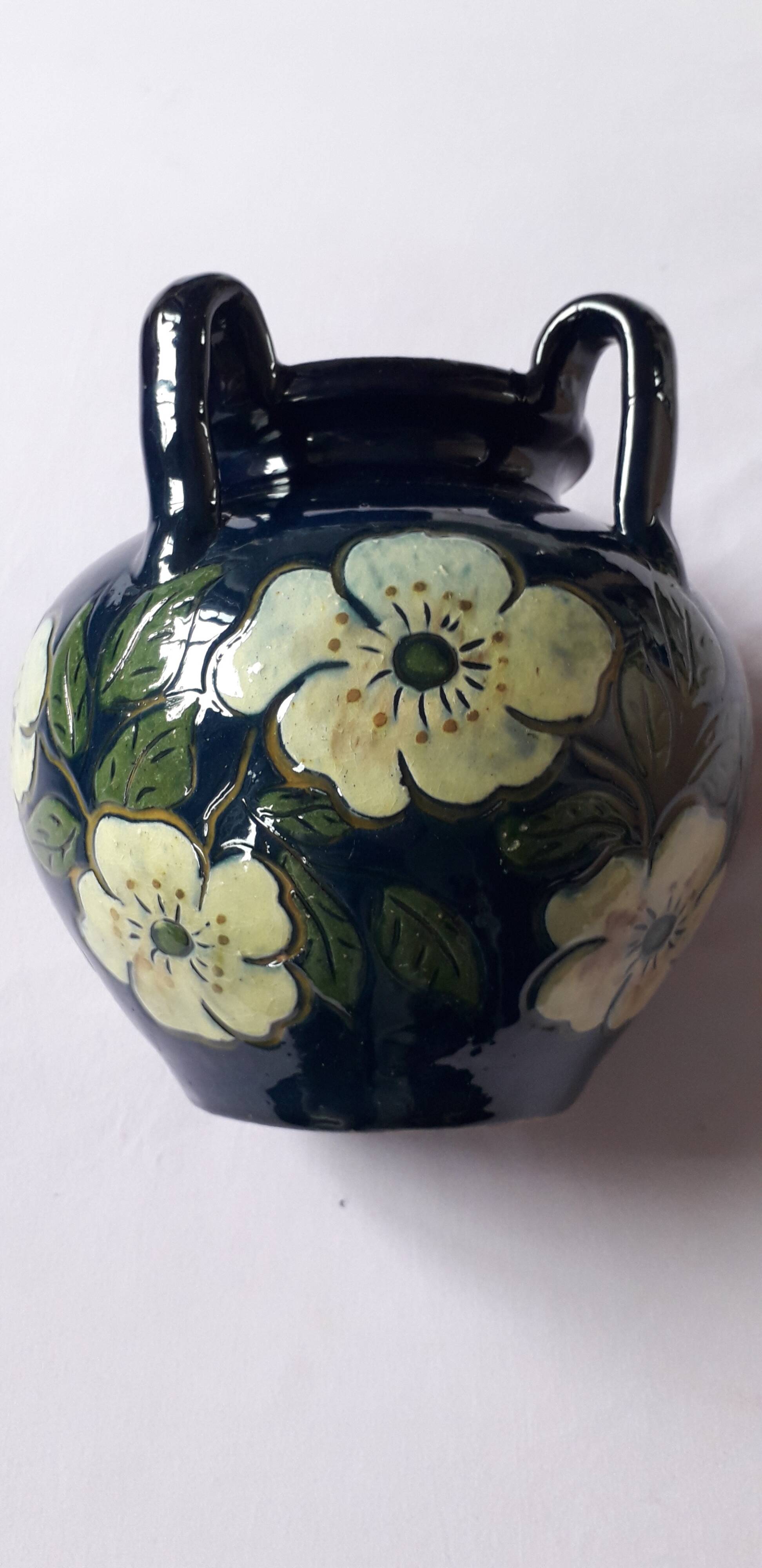 Antique Art Nouveau vase with floral decoration.