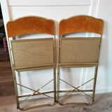 Two gold velvet folding chairs