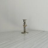 Patinated metal candle holder with knot
