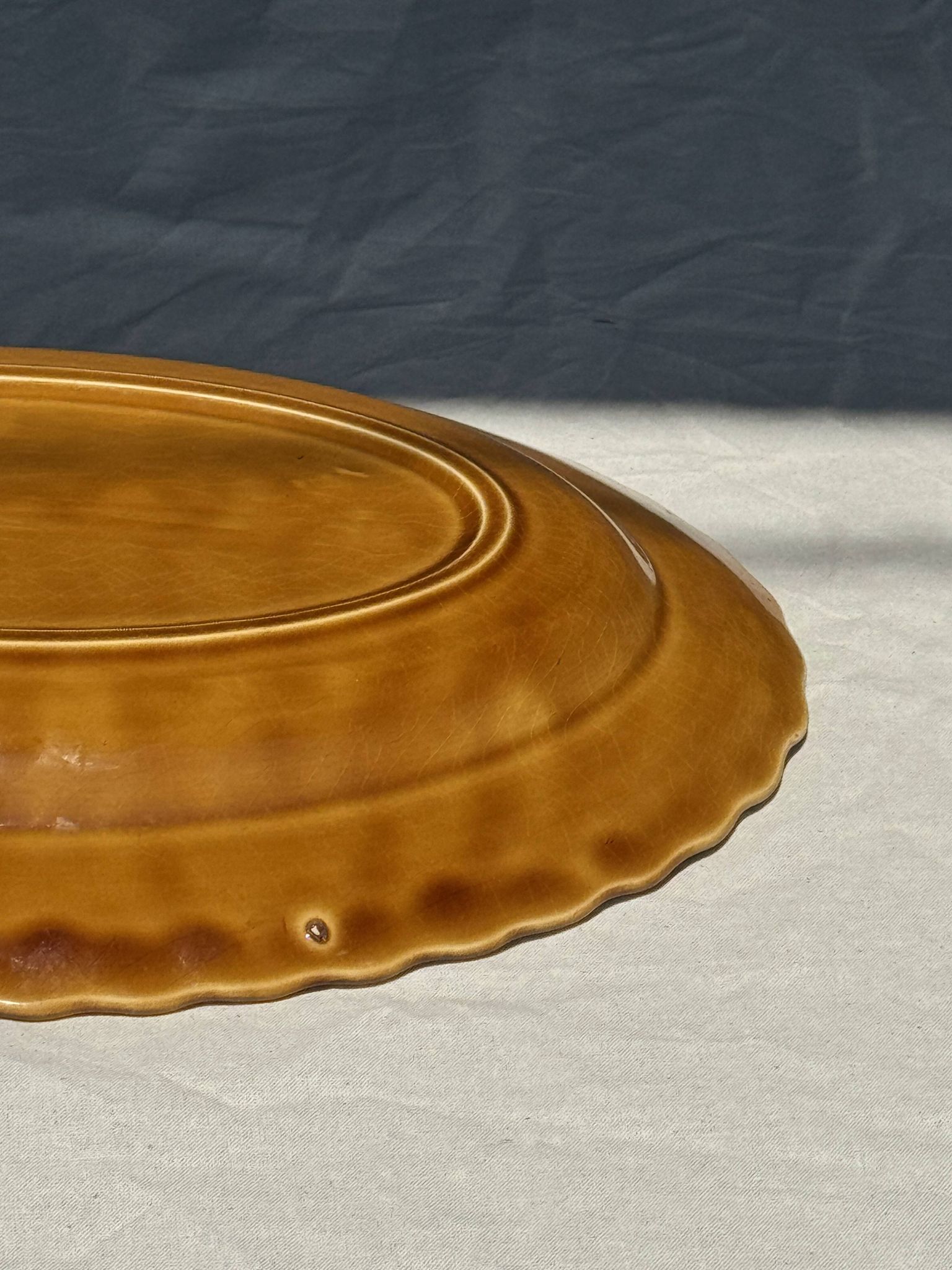 Antique oval dish, yellow-orange, frieze border L:24