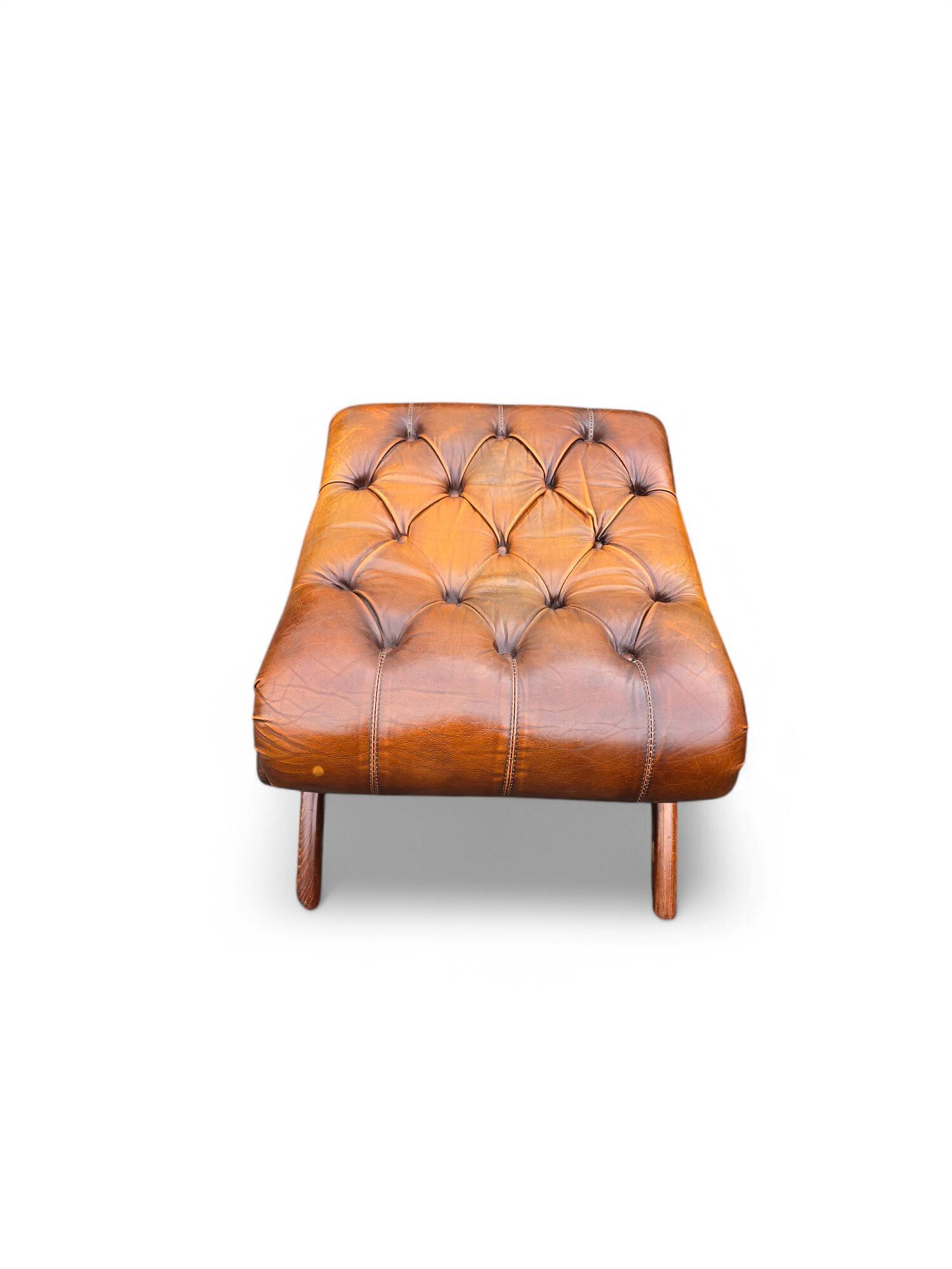 Pair of leather Chesterfields and footstools