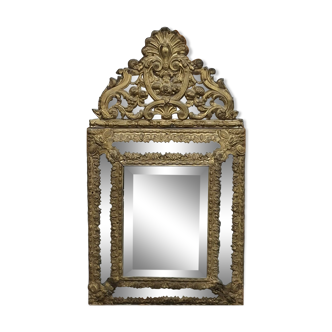 Miroir ancien biseaute  à parcloses en métal repoussé style Louis XIV