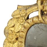 Petit miroir ancien patiné en bois doré du XIXe siècle
