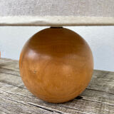 Wooden ball bedside lamp and beige lampshade