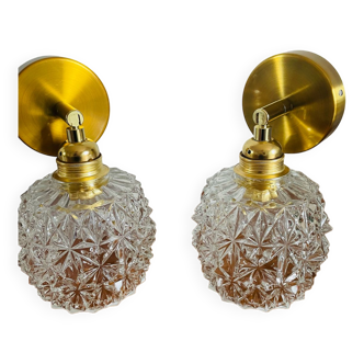 Pair of articulated wall lights on antique chiseled glass globes