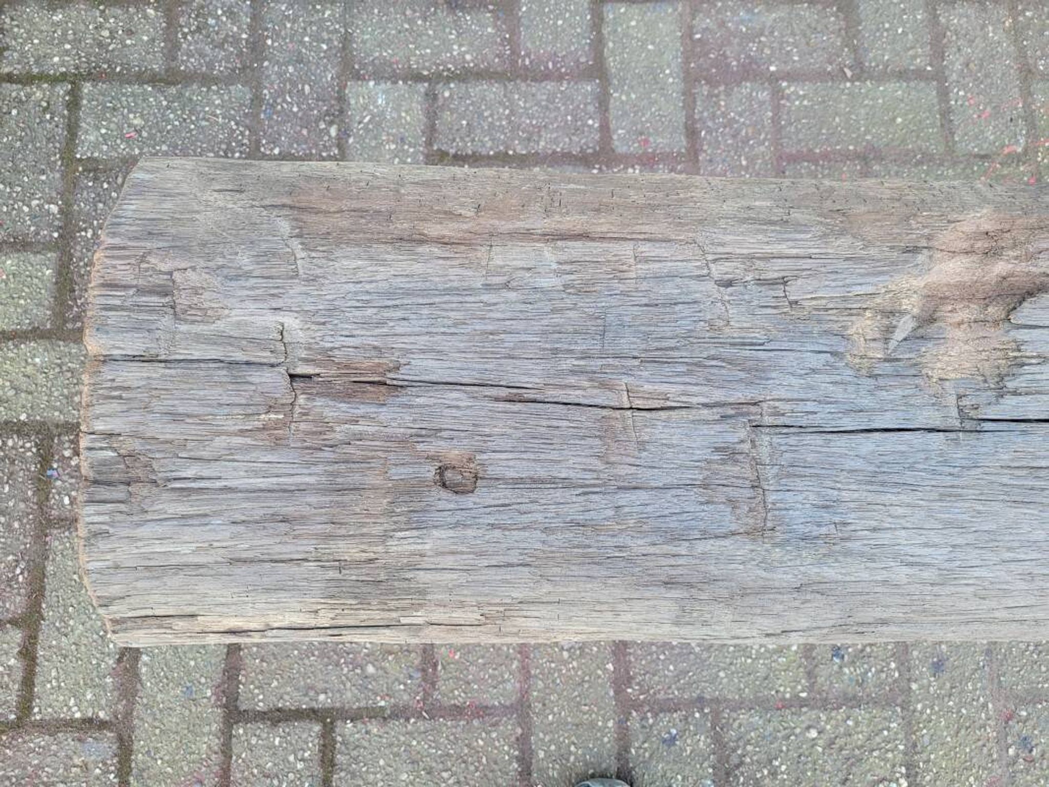 French country style cast iron bench with old rustic wooden plank