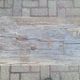 French country style cast iron bench with old rustic wooden plank