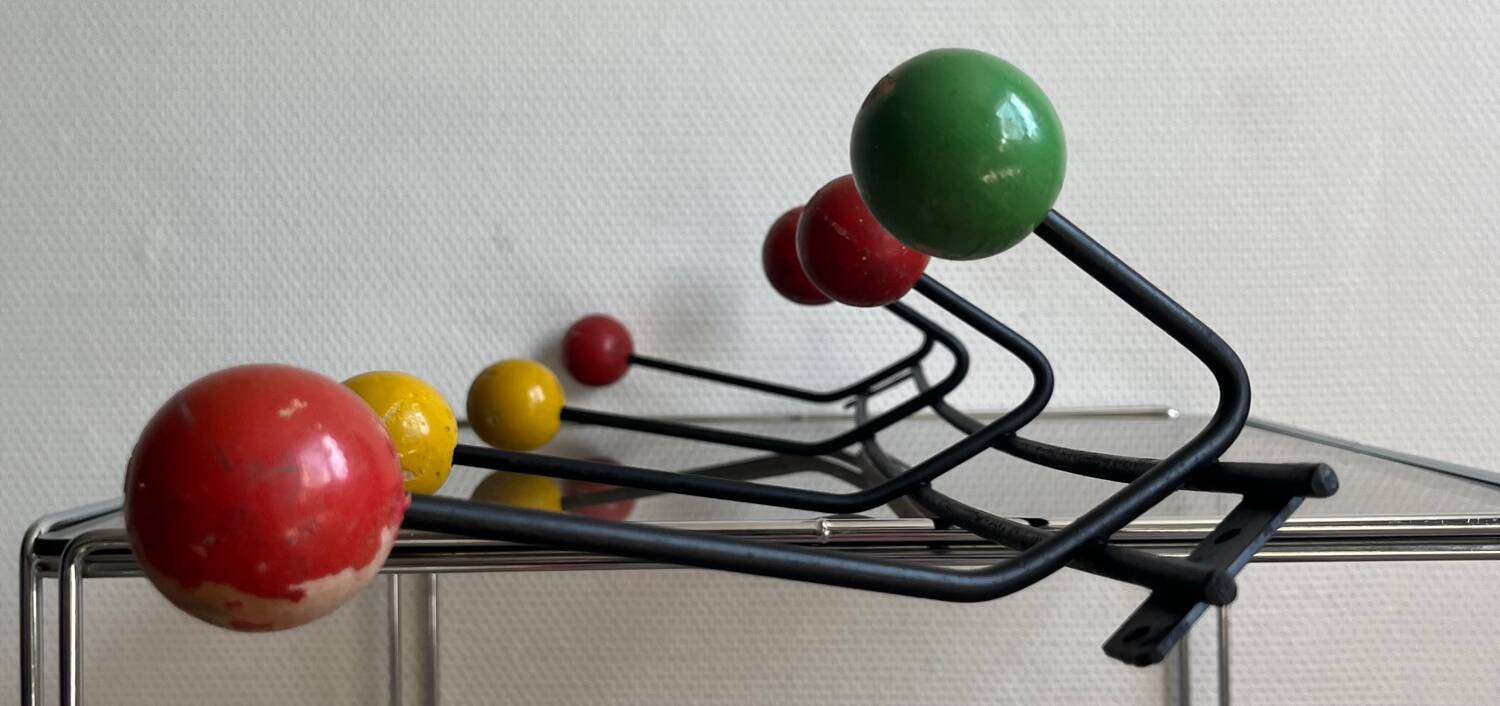 Iron wall coat rack and wooden hooks from the 60s