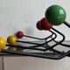 Iron wall coat rack and wooden hooks from the 60s