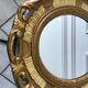 Miroir ovale médaillon en stuc doré années 70