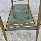 Vintage 1970s glass and gold rolling console table.