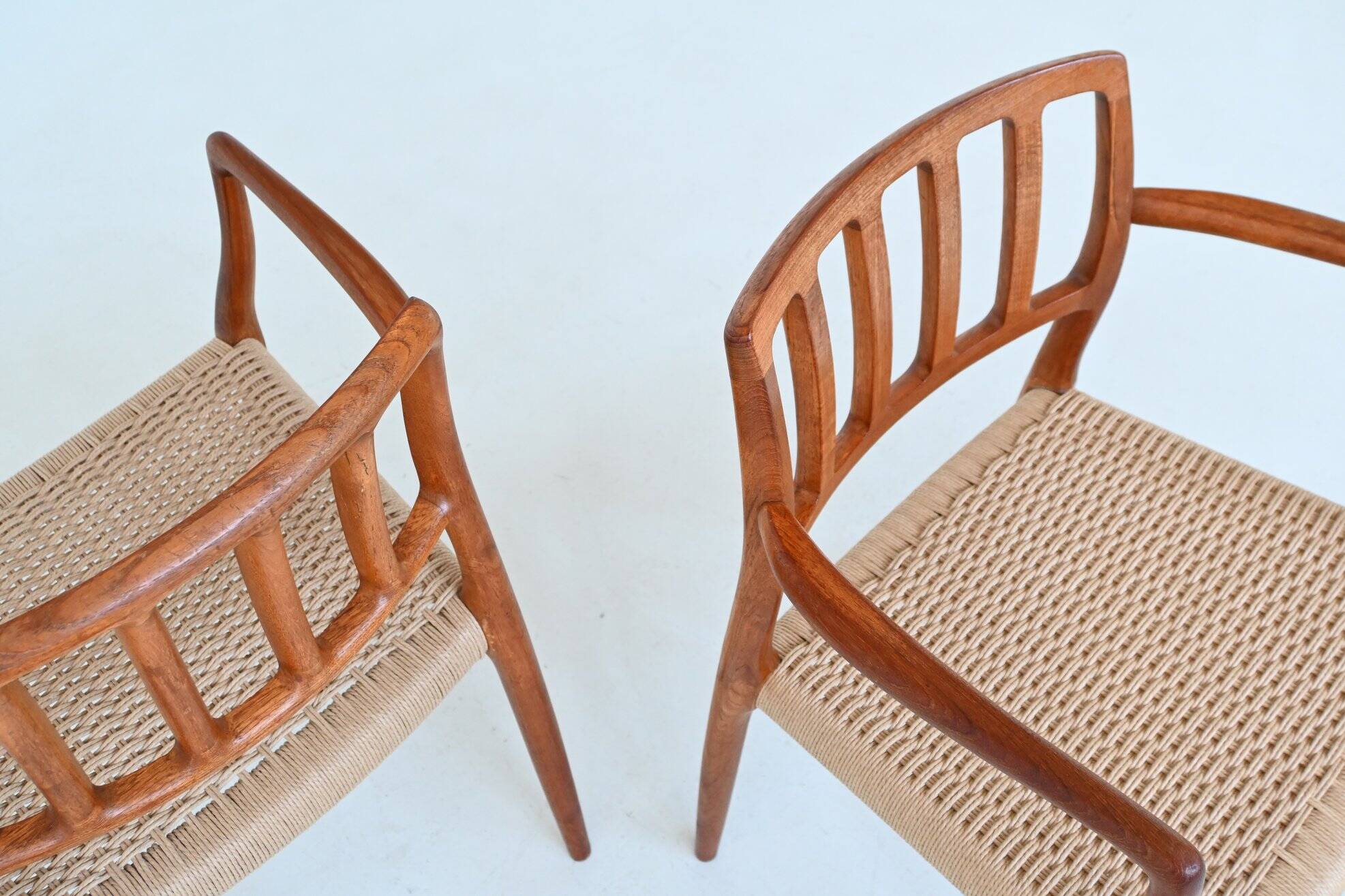Niels Otto Moller model 66 armchairs teak and paper cord Denmark 1974
