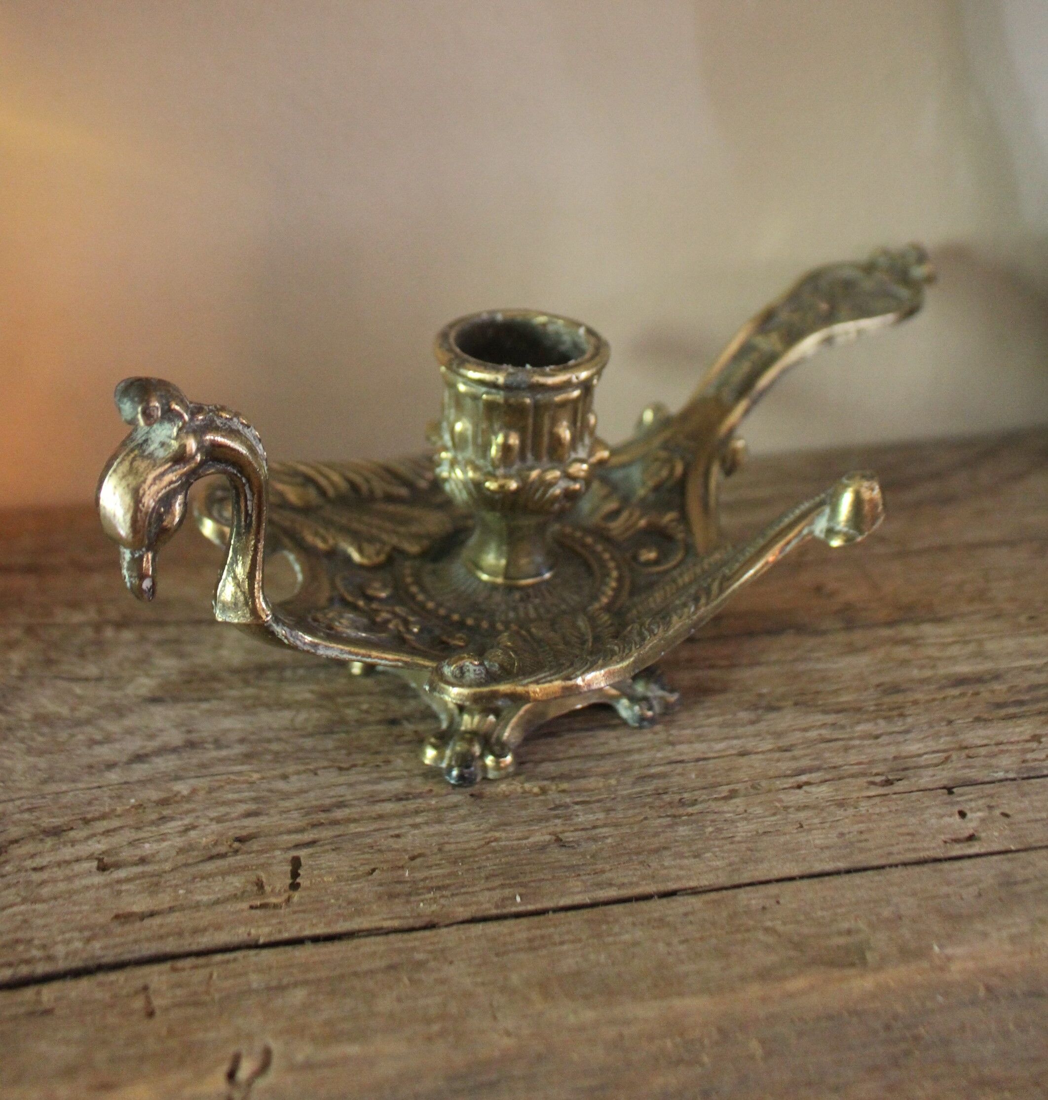 Brass candle holder cave rat peacock