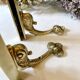 Brass wall supports for bathroom shelf, circa 1950.