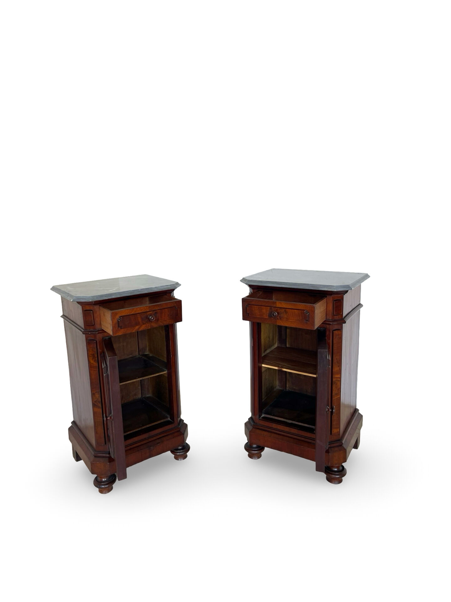 A pair of antique walnut bedside tables from the 1890s.