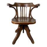 Baumann rotating wooden armchair