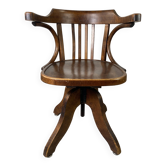 Baumann rotating wooden armchair