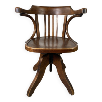Baumann rotating wooden armchair