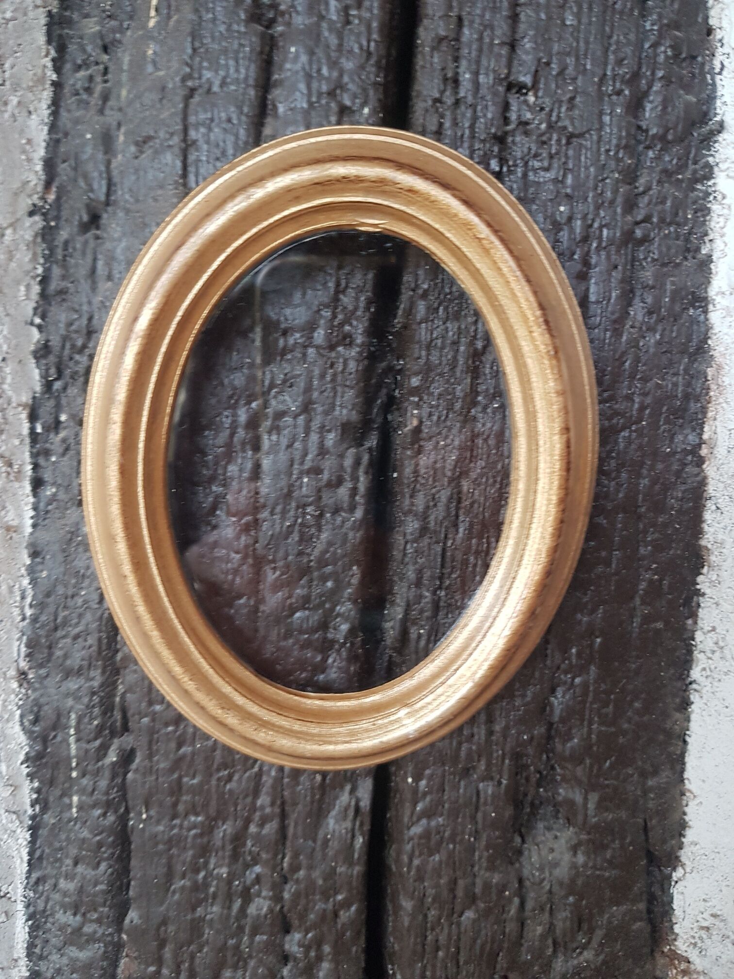 Small oval golden frame