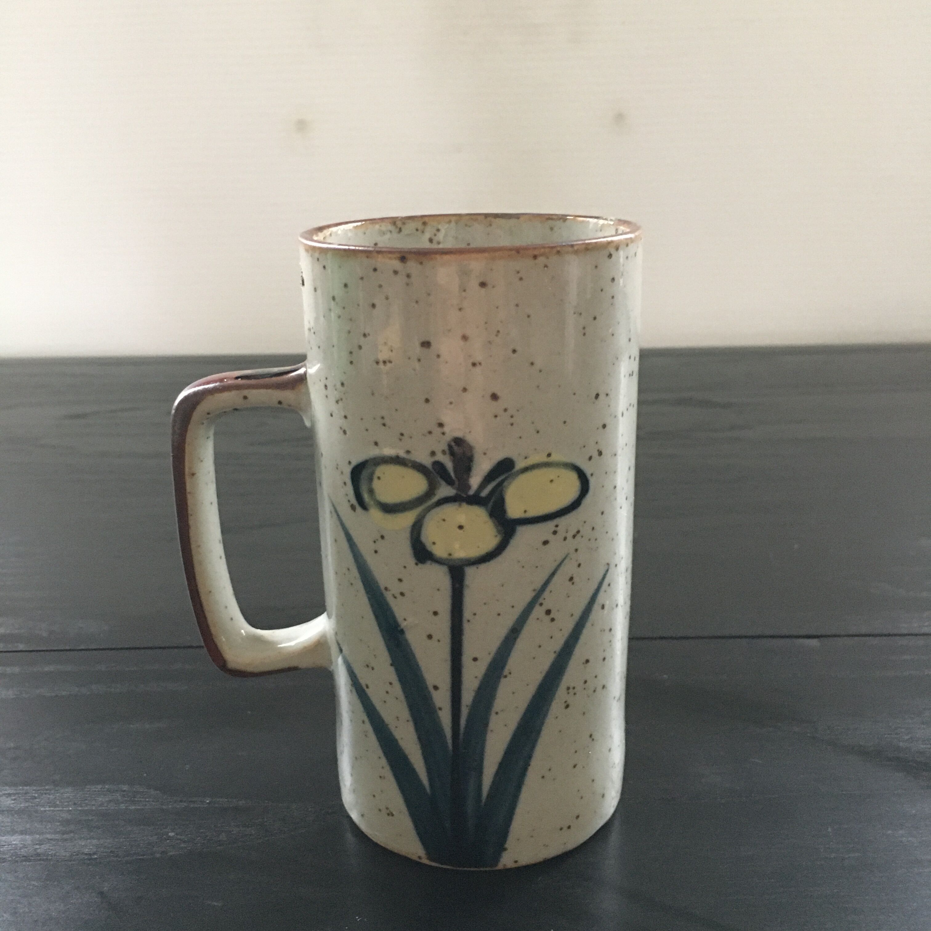 Stoneware mug with floral decoration