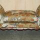 Antique banquette with cluster and ball feet, window seat in Mulberry Flying Ducks fabric.
