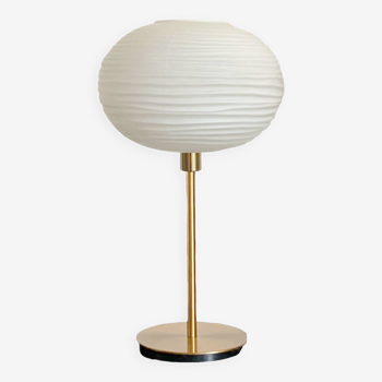 Table lamp made with an old globe in streaked white glass and a golden foot