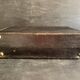 Small black grained leather travel suitcase from the 1920s
