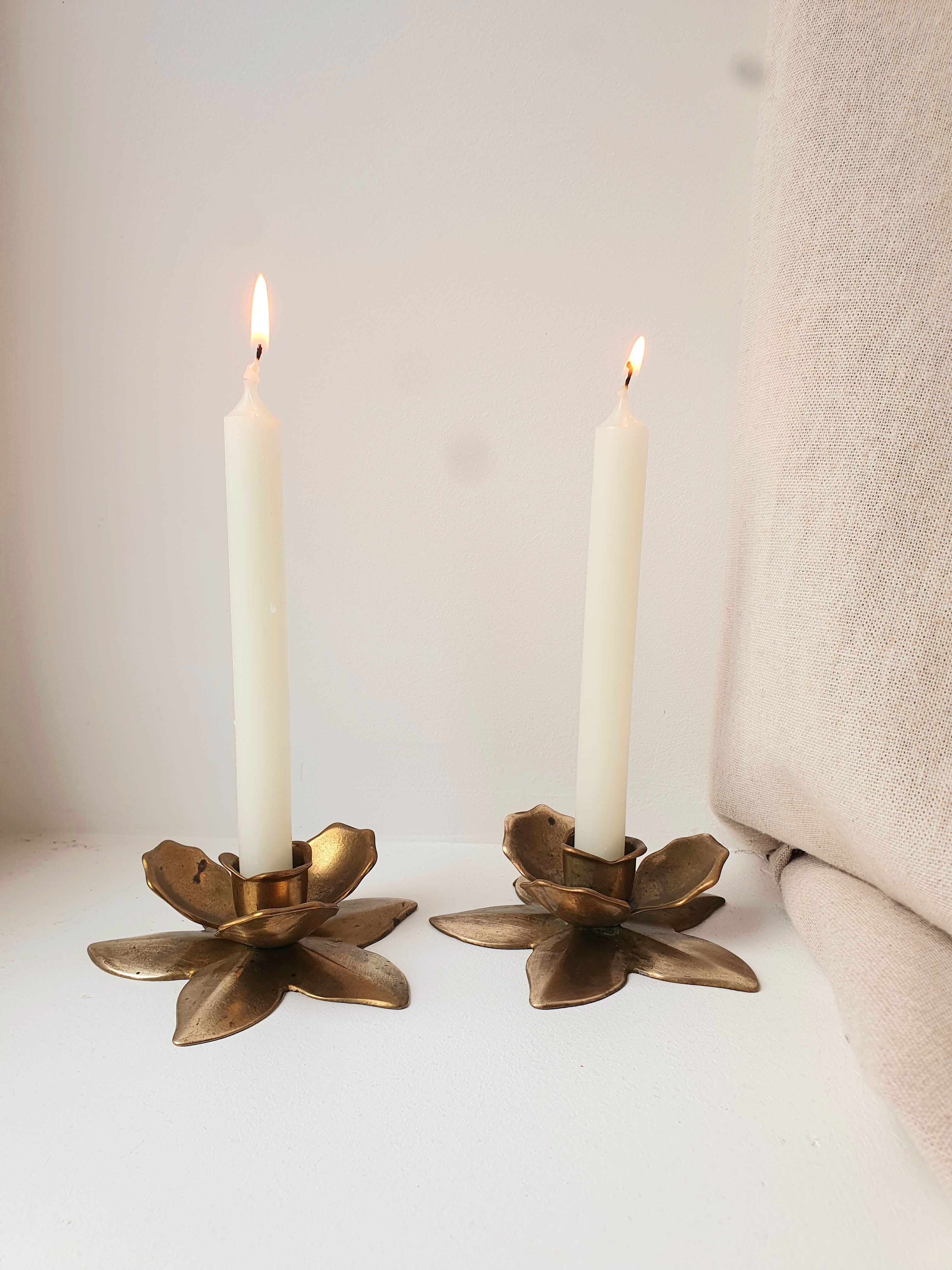 Two brass flower candlesticks