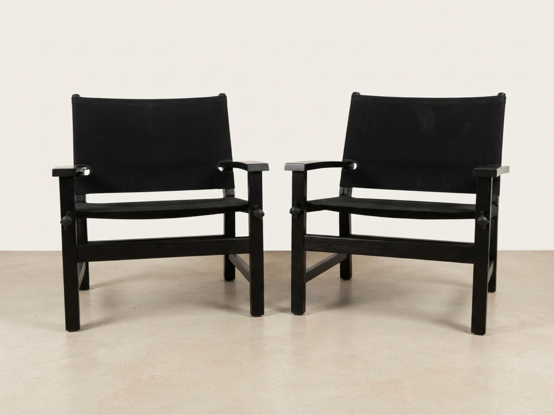 Pair of vintage "safari" style armchairs published by Hyllinge Møbler.