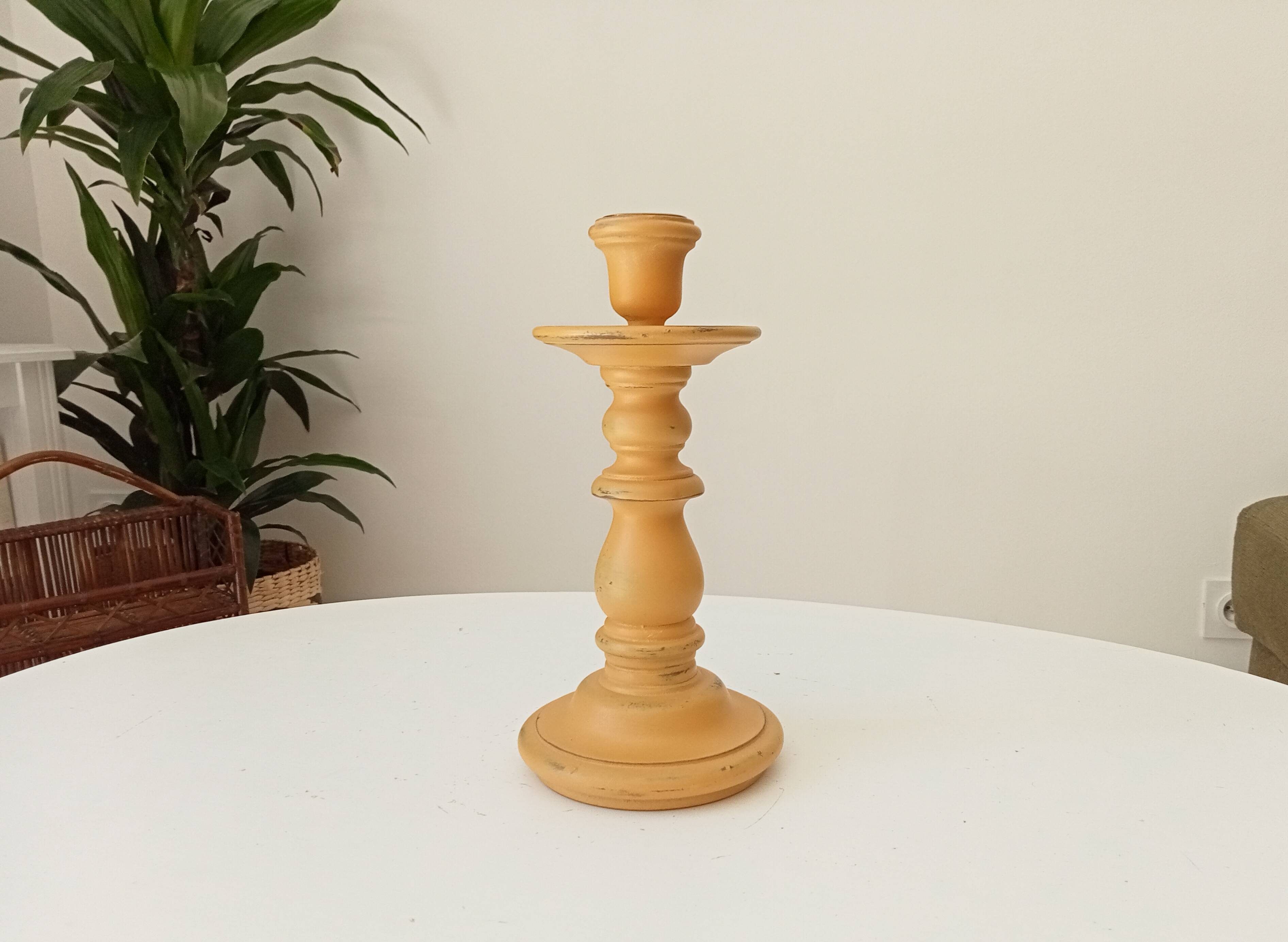 Vintage candle holder in weathered yellow wood