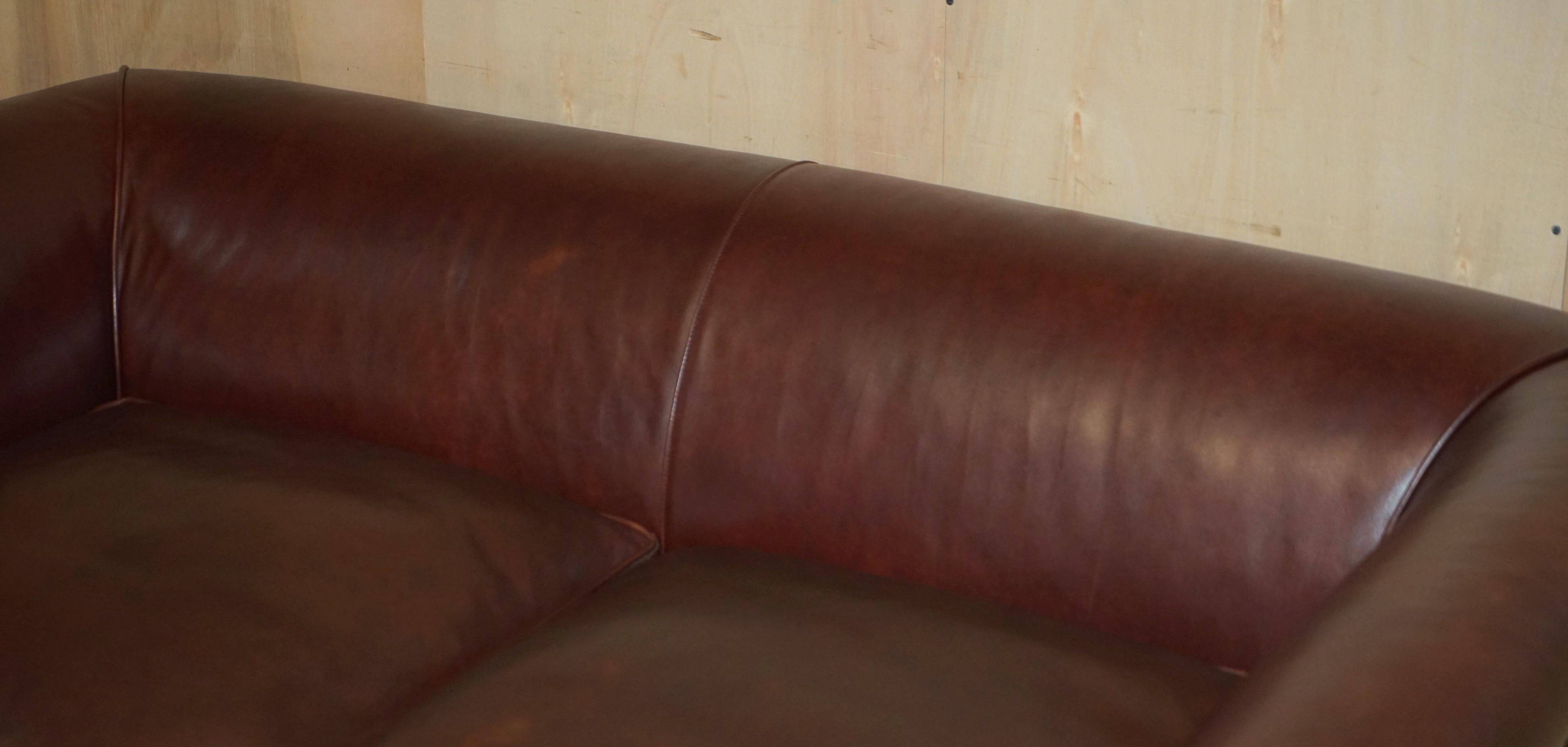 Vintage Art Deco leather sofa, three-seater, feather cushions.